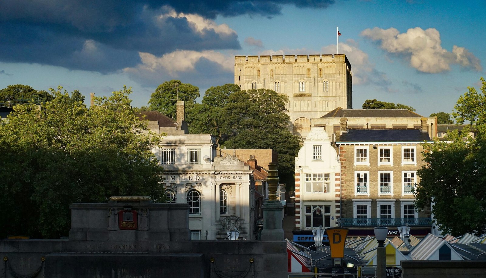 Beautiful view of Norwich Castle and cityscape under a dramatic sky with clouds.